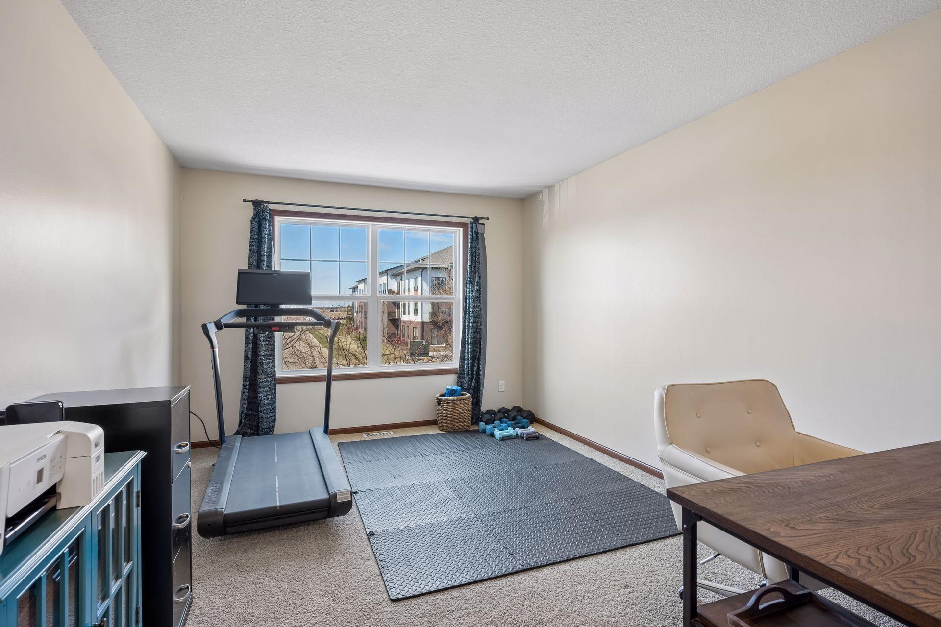 The loft has space for multiple uses: workout room, office, playroom, craft room, etc.