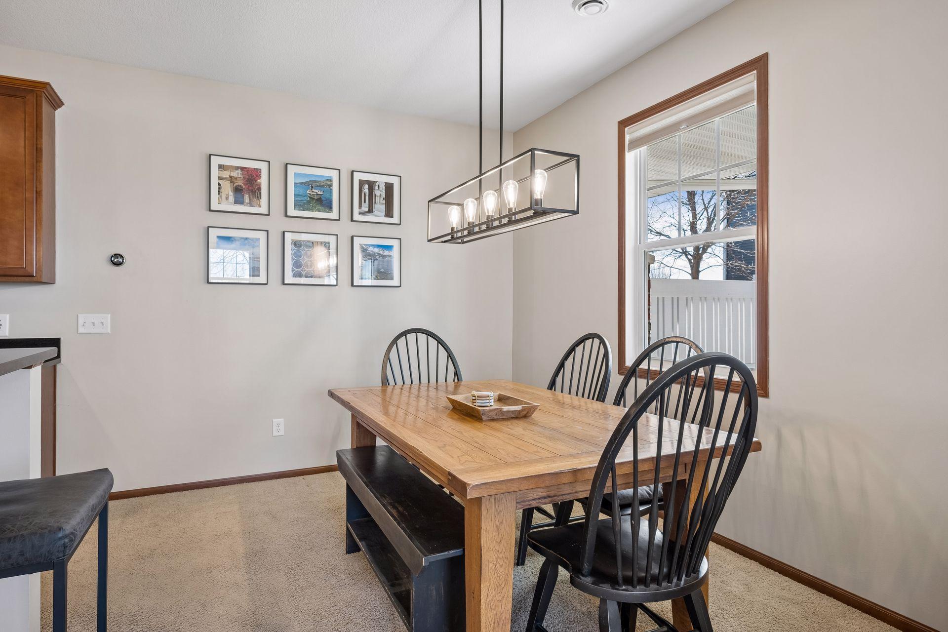 Amazing dining space off the kitchen with updated lighting and a window that opens for fresh air.