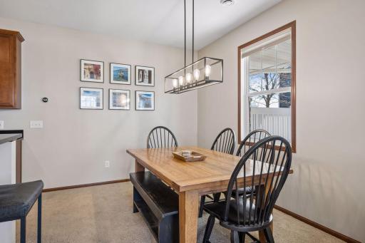 Amazing dining space off the kitchen with updated lighting and a window that opens for fresh air.