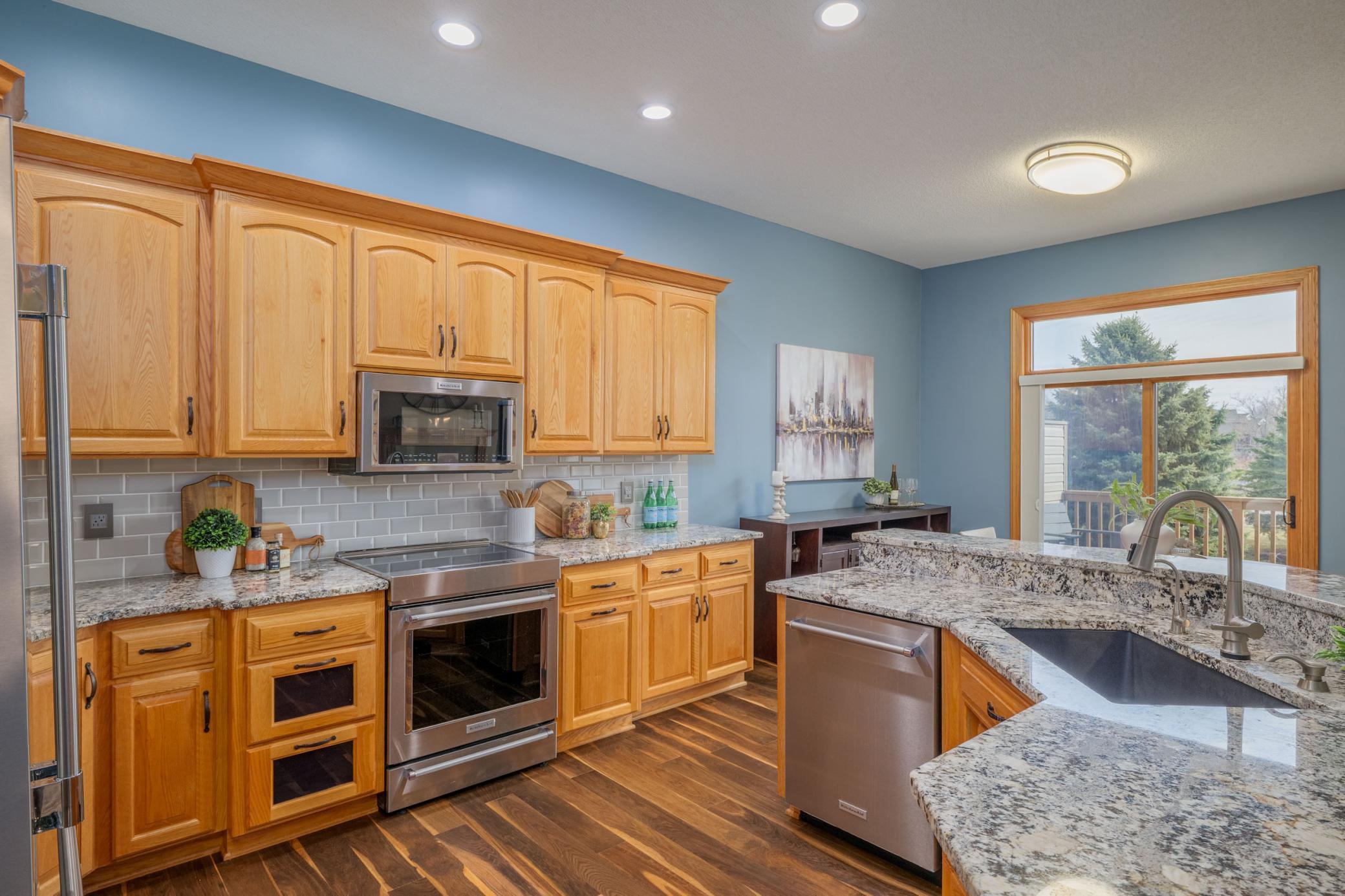 Updated kitchen offers an informal eating area that walks right out to your private deck.