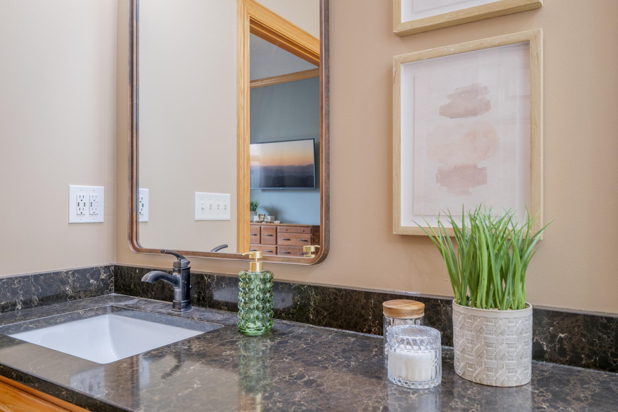 Modern priamary bath offers dual sinks and updated countertops!