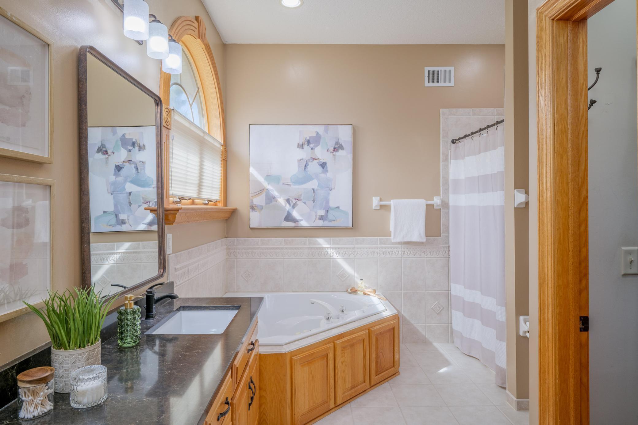 Even the primary bathroom offers an abundance of natural light!