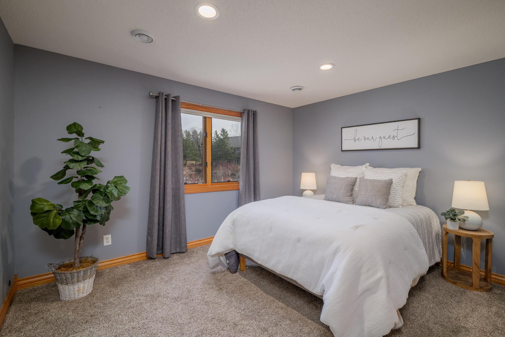 Third bedroom is spacious and offers pond views in the lower level.