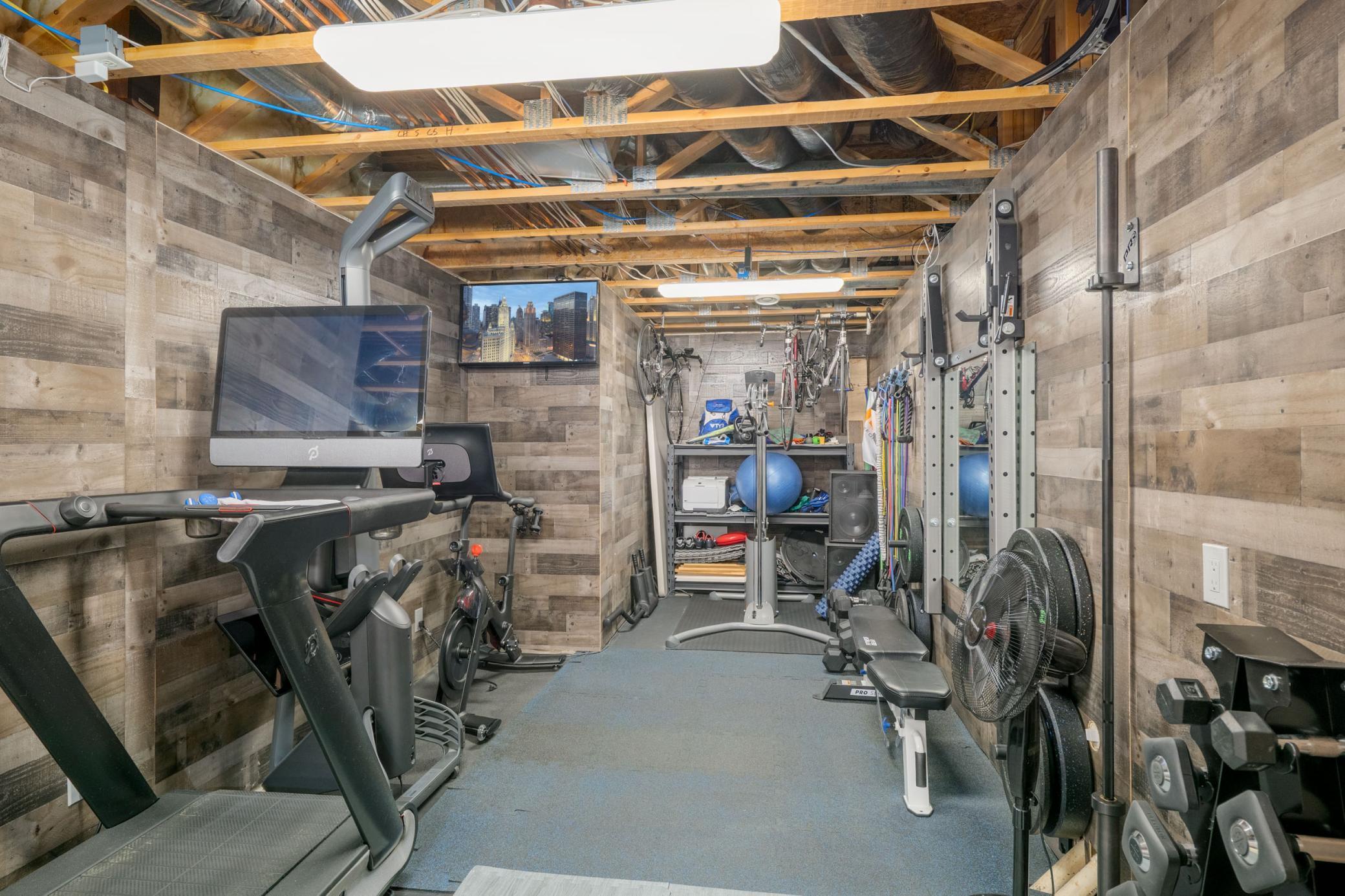 This unfinished space makes the perfect home gym or hobby room!