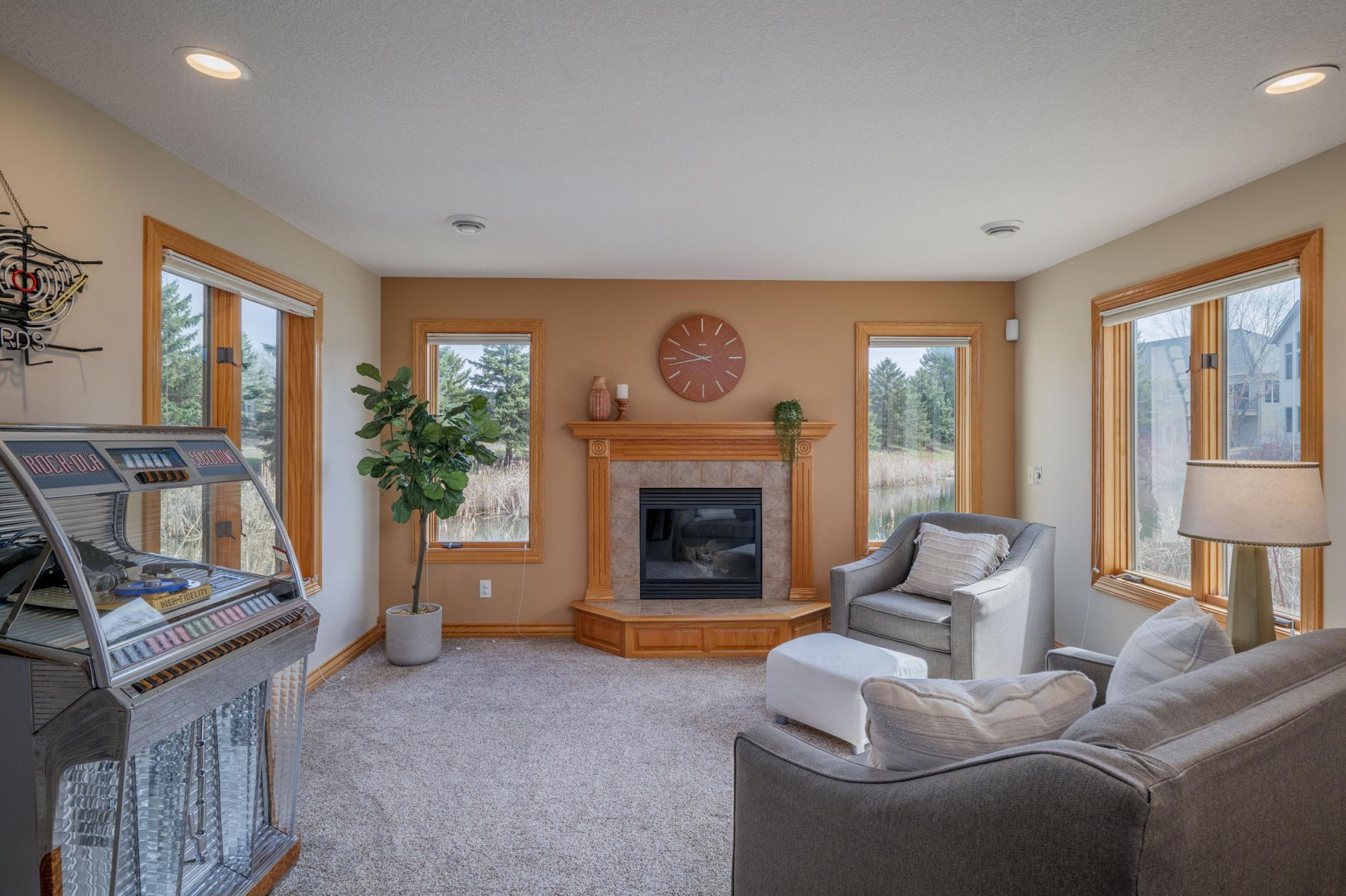 Sit around the second fireplace in this spacious lower level nook! Plenty of living spaces to choose from.