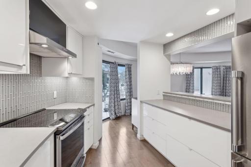 The kitchen has a convenient breakfast bar that overlooks the living area