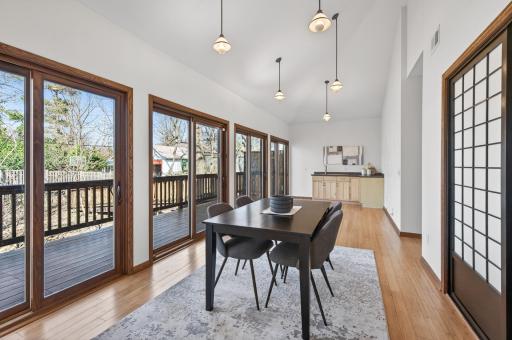 Upstairs dining and kitchen - with a wall of windows stepping out to the deck