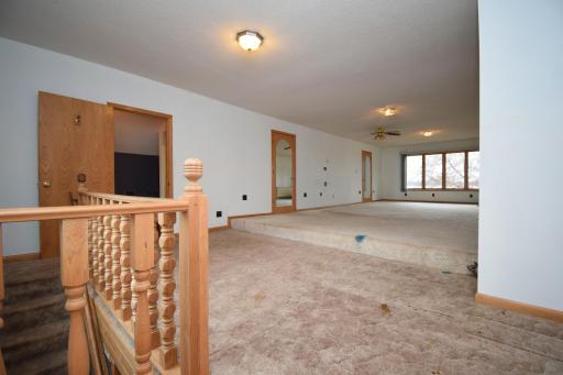 upper level master suite with 2 separate walk-in closets and 3/4 bath