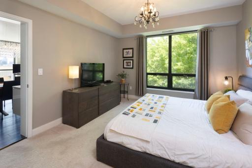 Carlyle 607 - Primary bedroom with operable hopper windows for fresh air