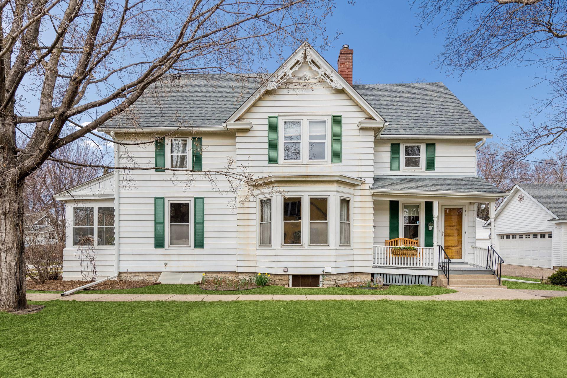 Victorian architecture shines through with the decorative gabled roofline, bay window, and charming porches