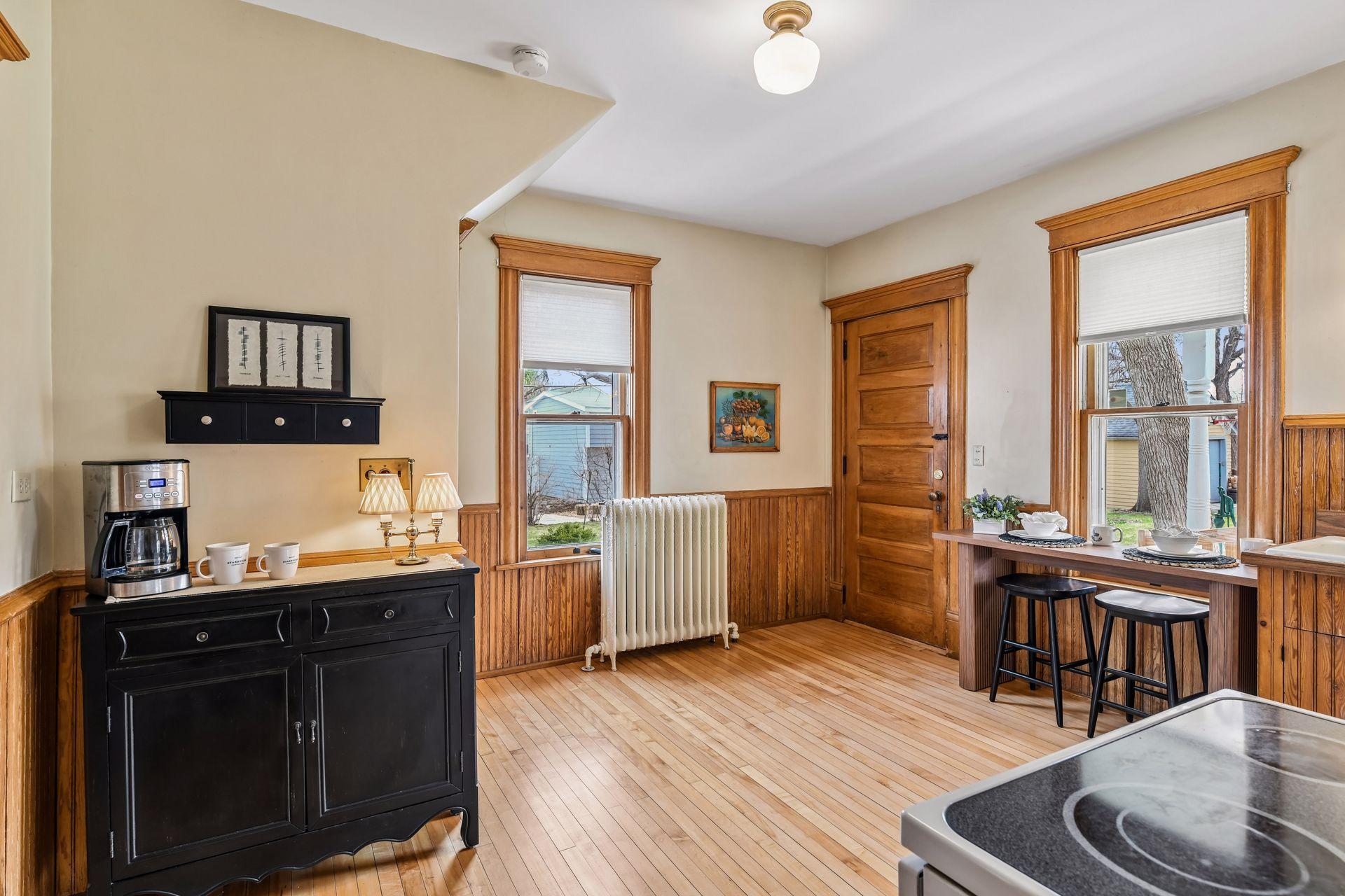 A roomy kitchen featuring a charming coffee bar area.