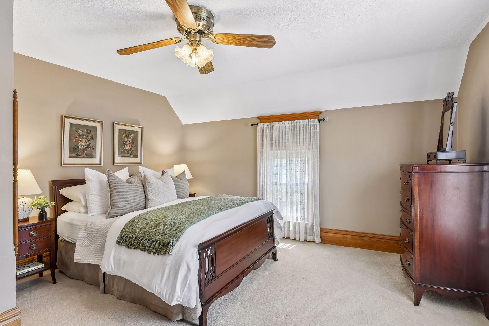 Located at the top of the stairs, the south and west-facing primary bedroom is filled with natural light.