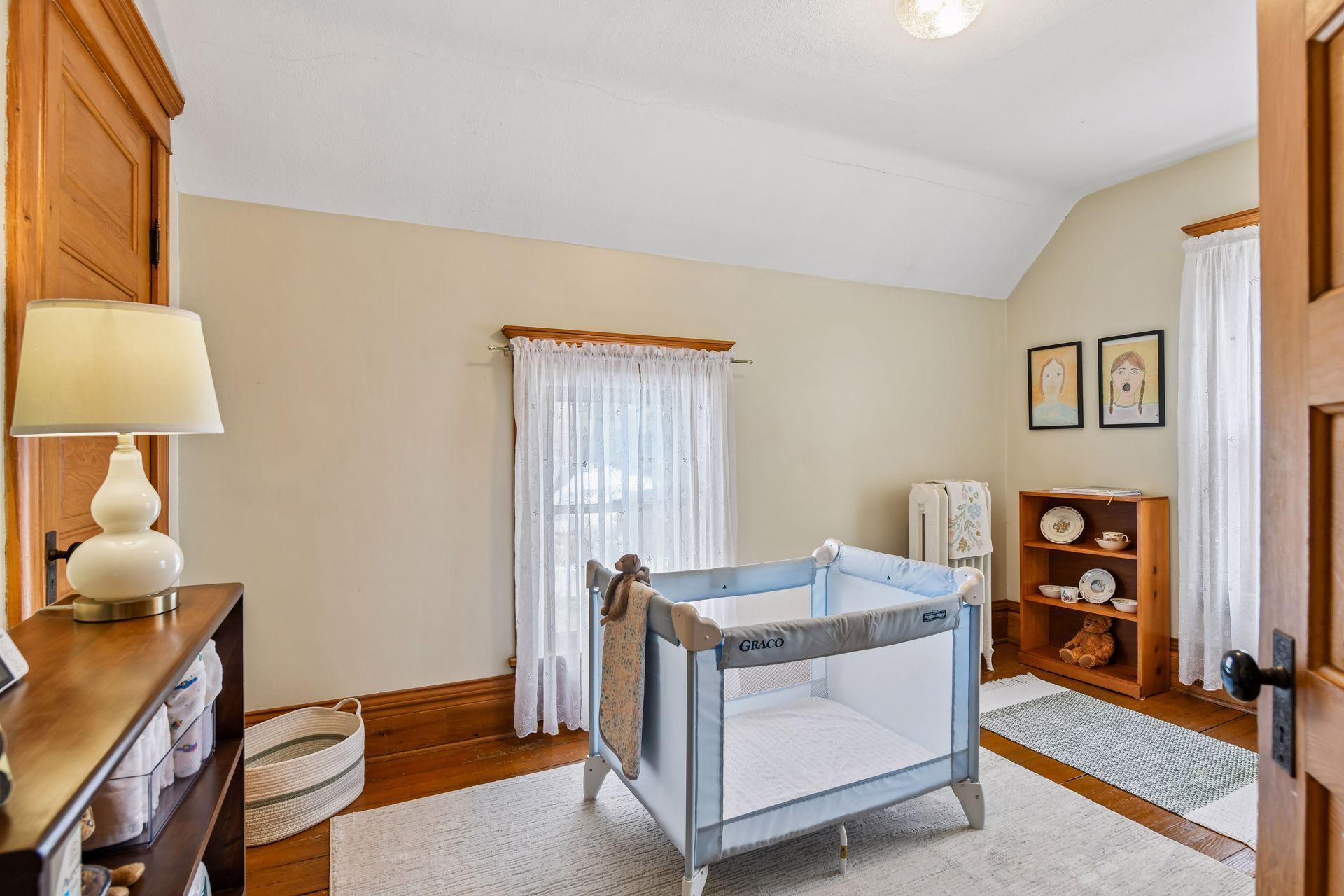 The fourth bedroom offers flexibility, functioning as a nursery and home office.