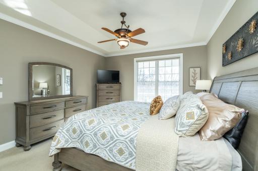 Primary bedroom has walk-in closet with custom shelves