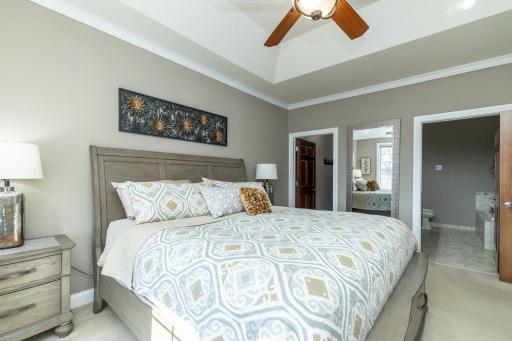 Primary bedroom ensuite with walk-in closet and private full bathroom