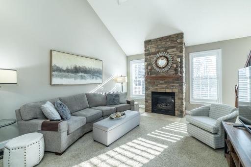Two story great room with stack stone fireplace