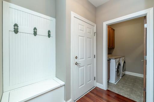 Main floor built-in hallway bench with storage and coat hooks
