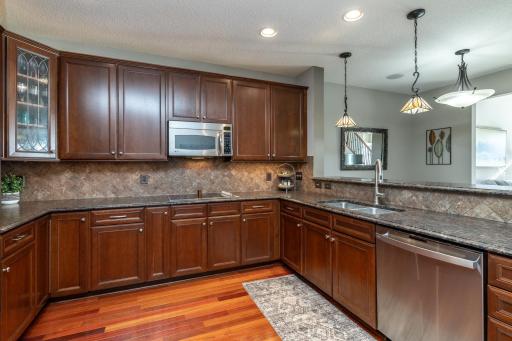Upgraded kitchen with leather granite, tile backsplash, stainless steel appliances, and more!