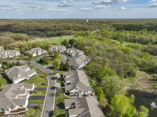 Townhome surrounded by green space and pond