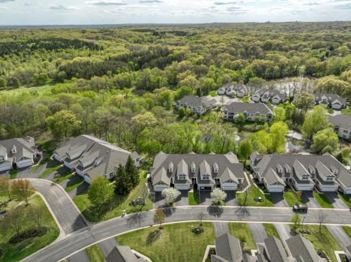 Townhome surrounded by green space and pond