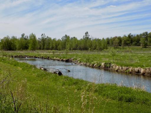 Walking trail and water next to property