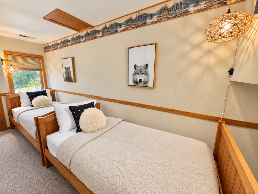 Lower level bedroom with two twin beds.png