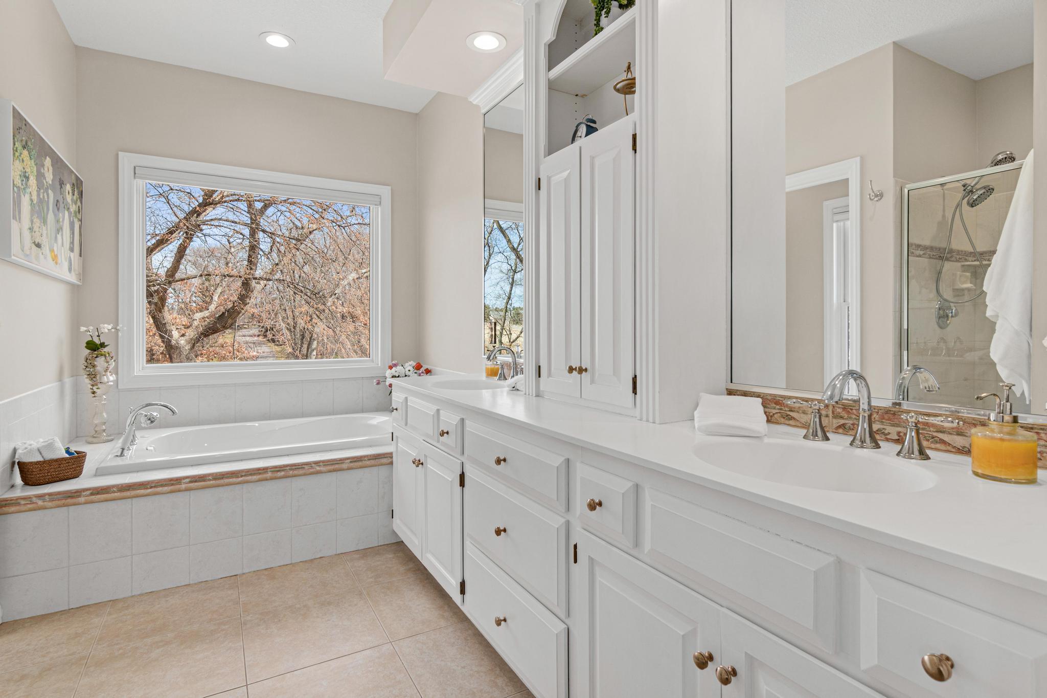 Well-appointed primary bath designed for relaxation with quality finishes throughout.