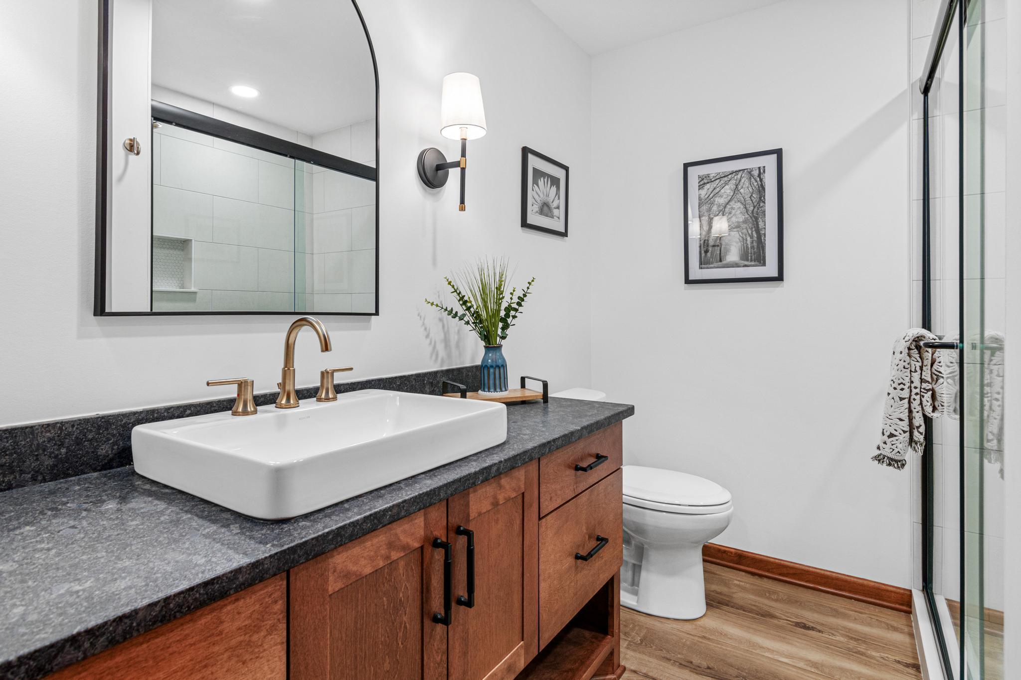 New bathroom added in the remodel- is perfect for guests or after completing a rigorous workout.