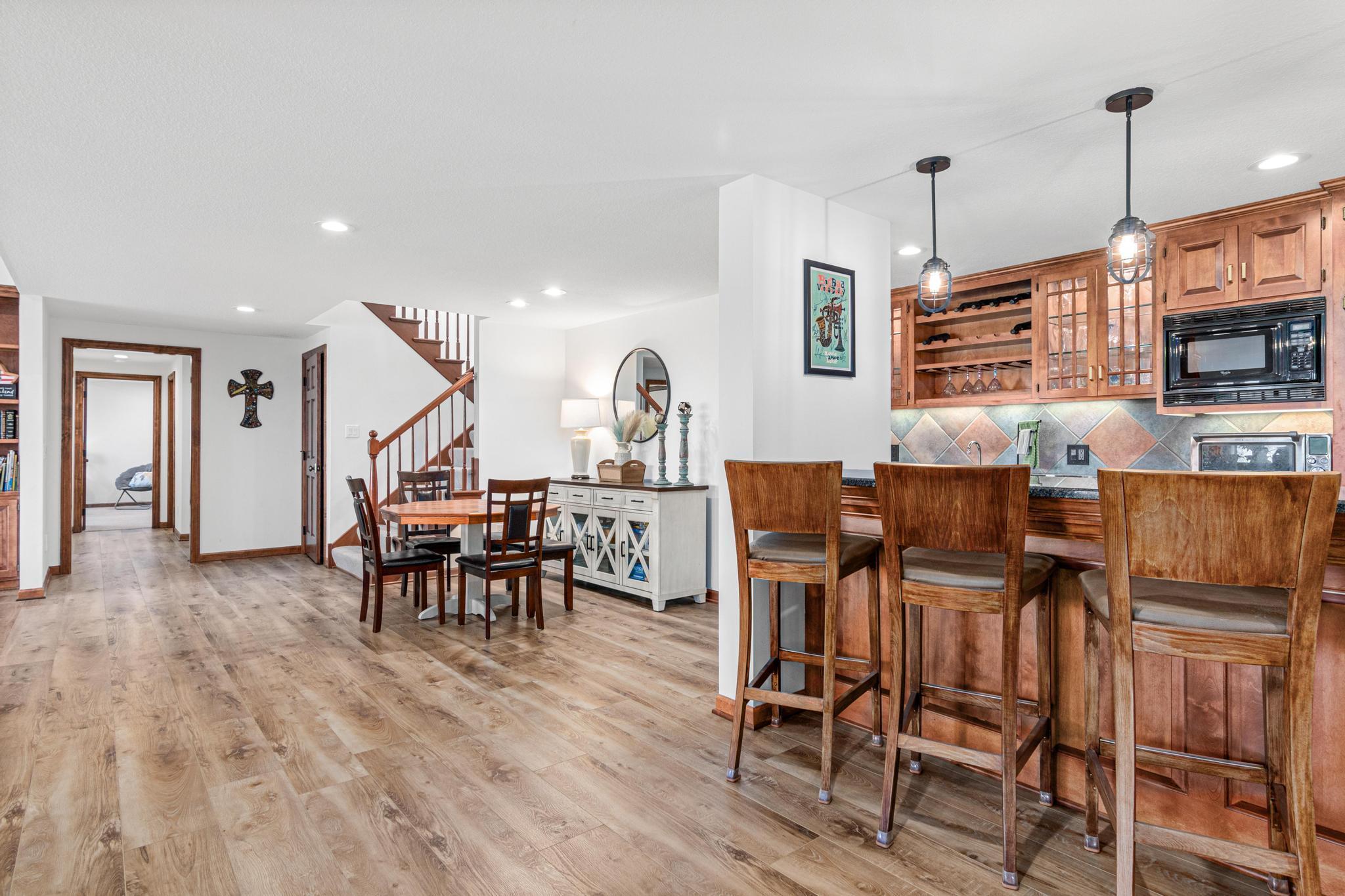 The lower level has it all! Two spacious bedrooms, two bathrooms, a study, an exercise room, expansive storage rooms, family room and bar.