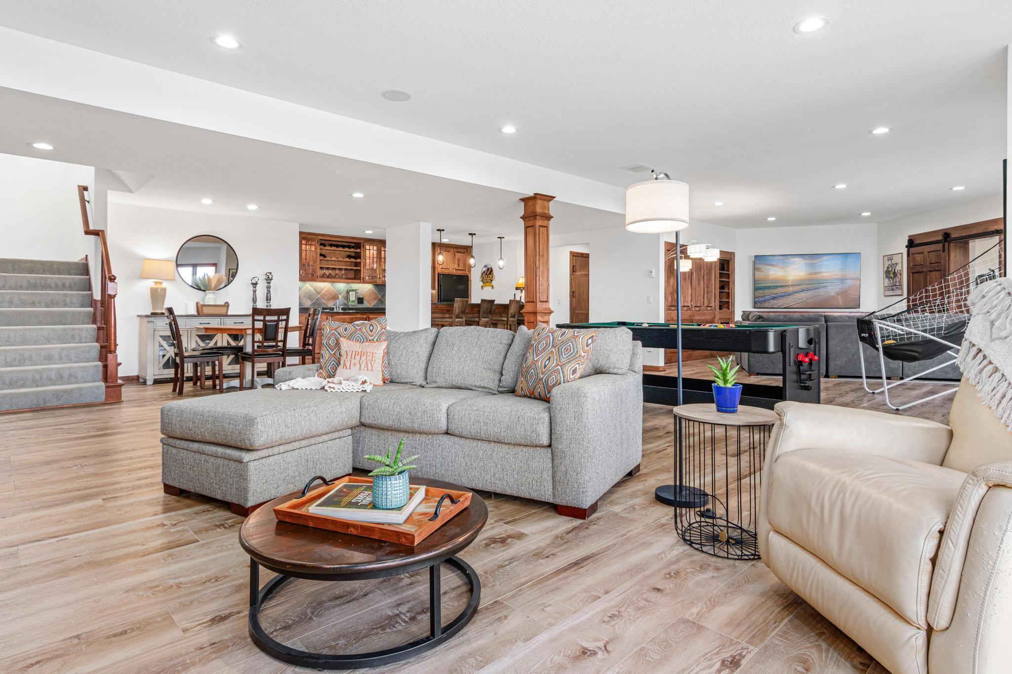 Invite family and friends over for fun and games! Numerous areas to watch the big game, your favorite movie, play cards, shoot hoops and more. This lower level has it all!