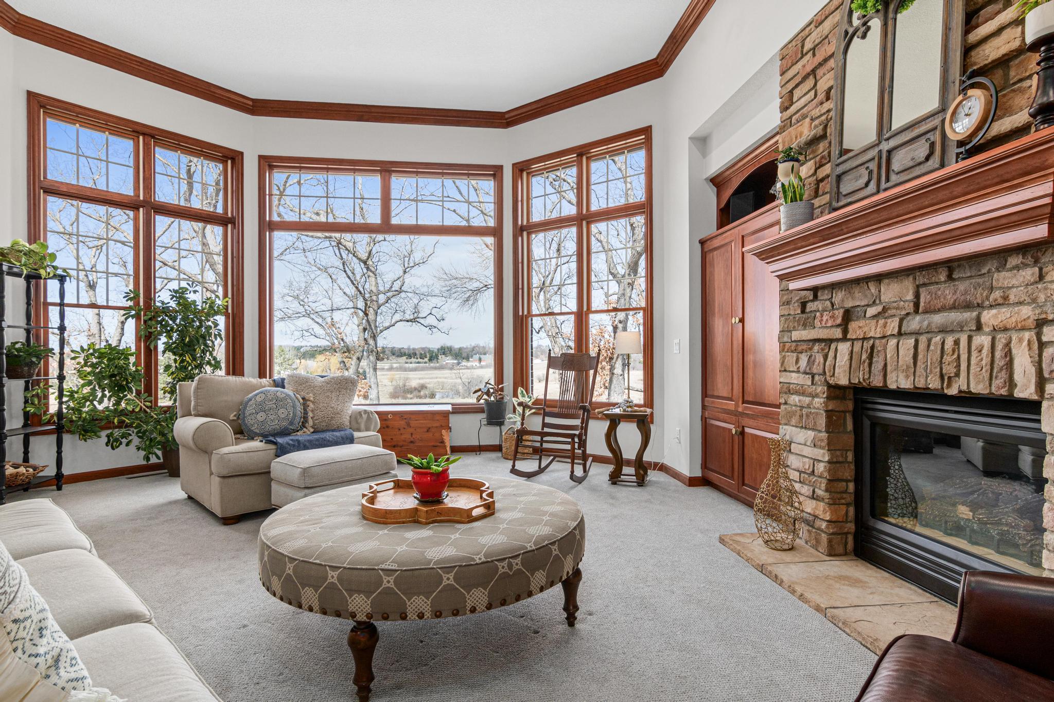 Light-filled great room featuring walls of windows that frame stunning views of the surrounding landscape.