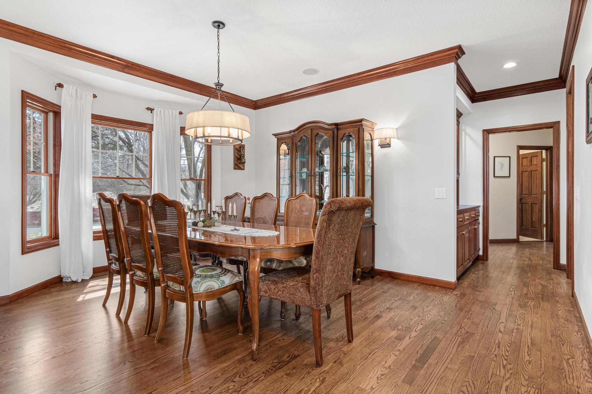 Formal dining room is the perfect place to host the holidays, book club and more. Butler's pantry provides easy entertaining.