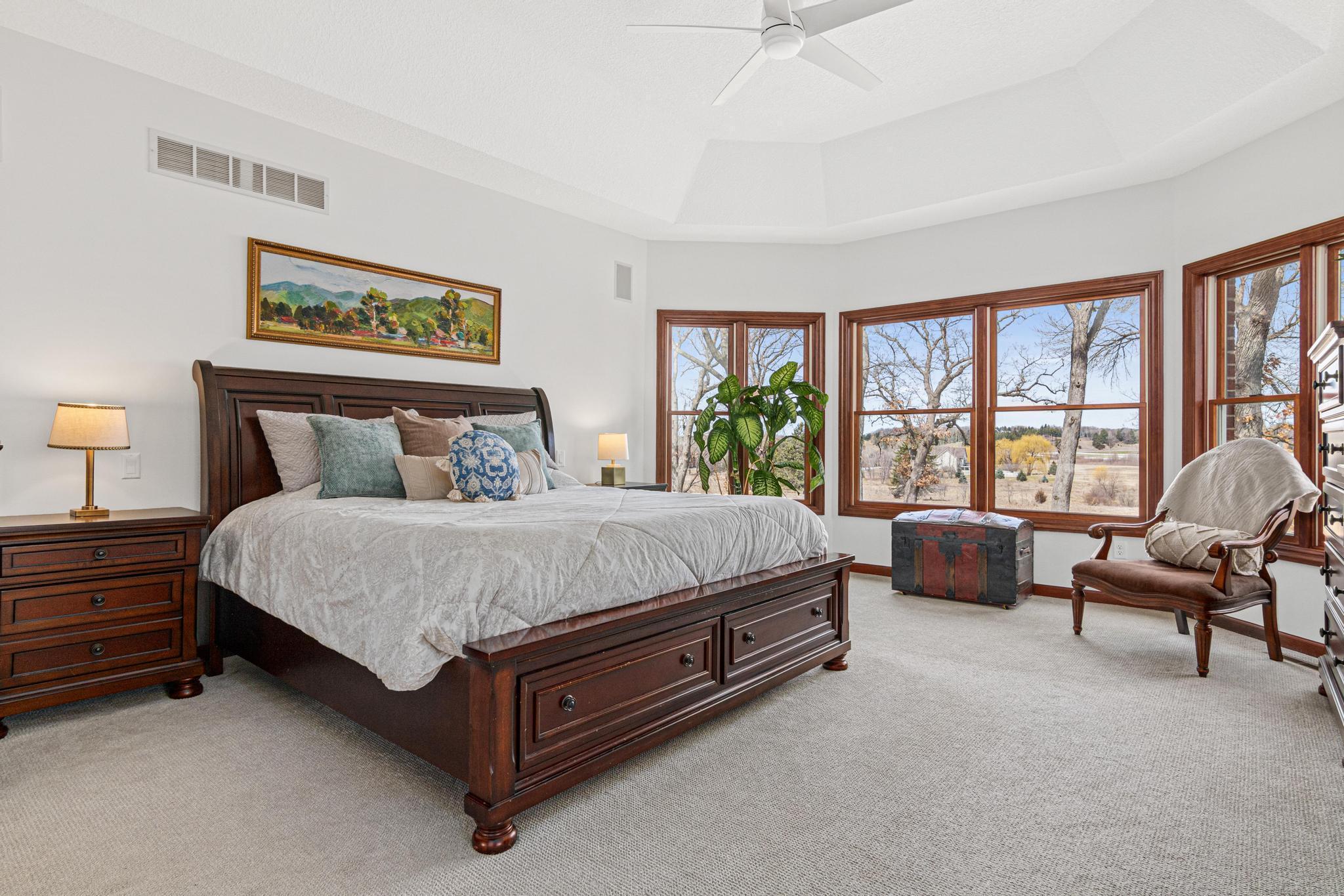 Luxurious main-level primary suite offering comfort, privacy, and tranquil views.