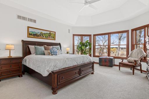 Luxurious main-level primary suite offering comfort, privacy, and tranquil views.