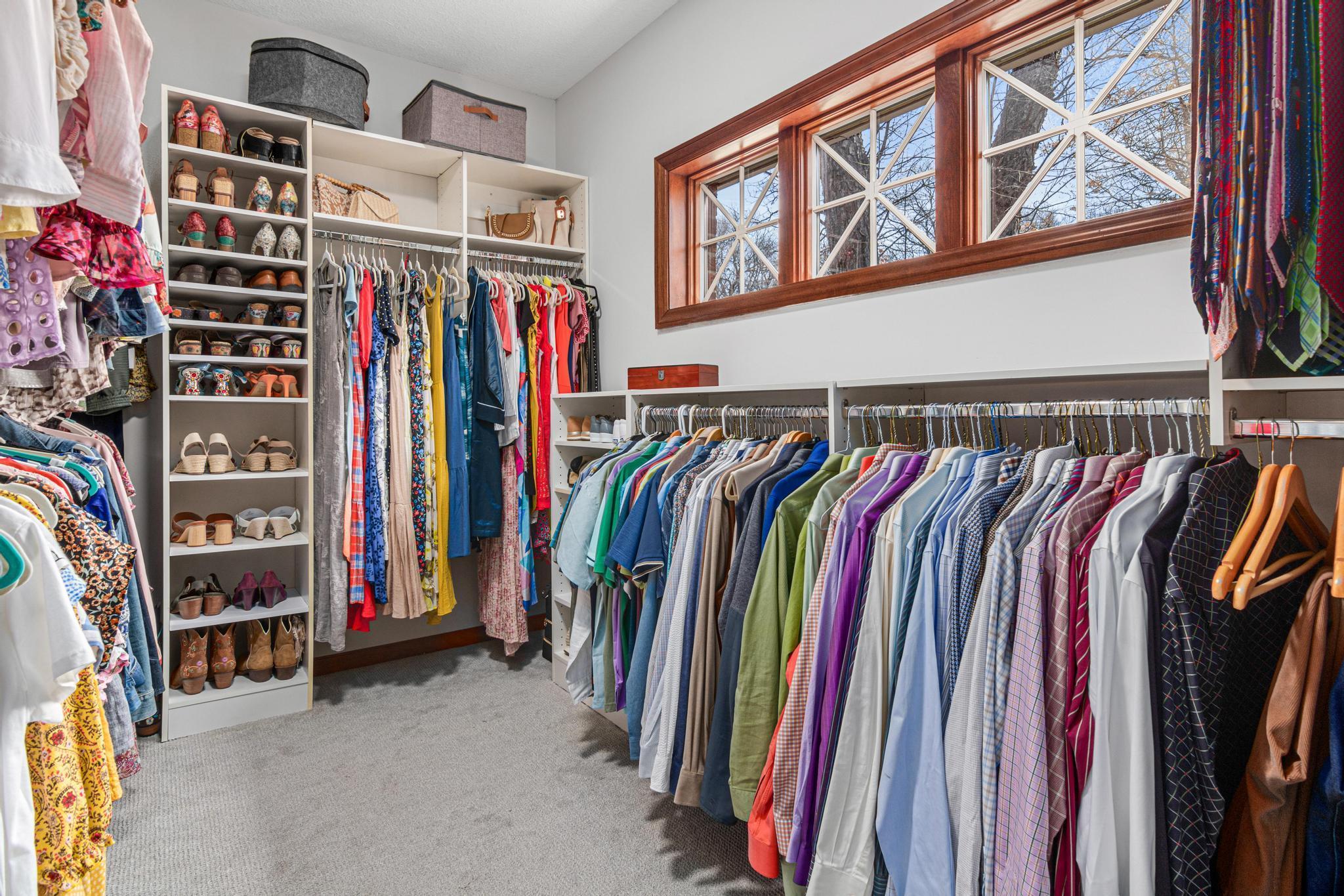Fantastic owner's closet with dynamite organizing system.