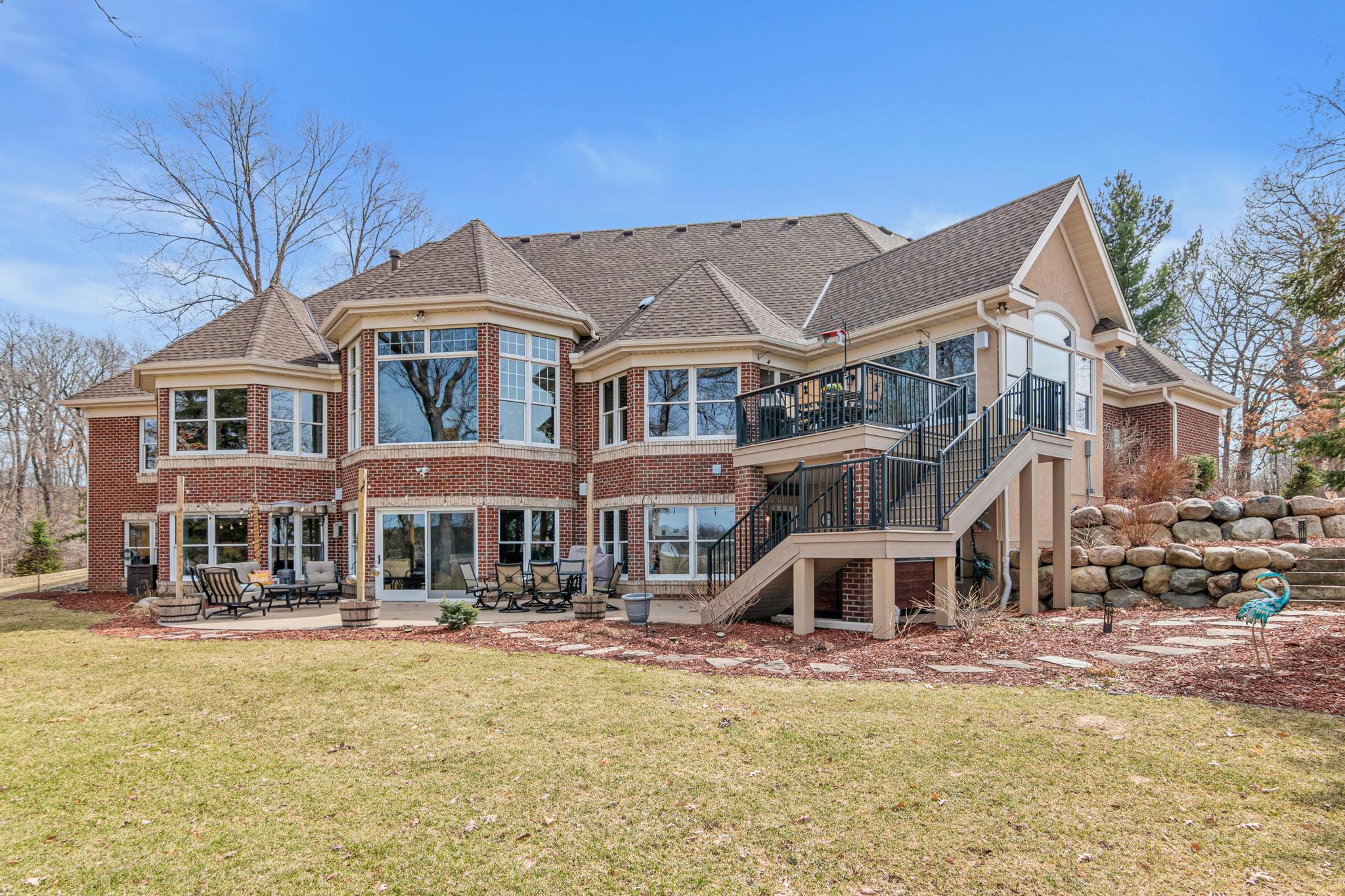 Beautifully maintained grounds create a serene retreat, perfect for relaxing or entertaining outdoors.