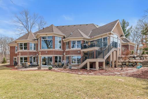 Beautifully maintained grounds create a serene retreat, perfect for relaxing or entertaining outdoors.