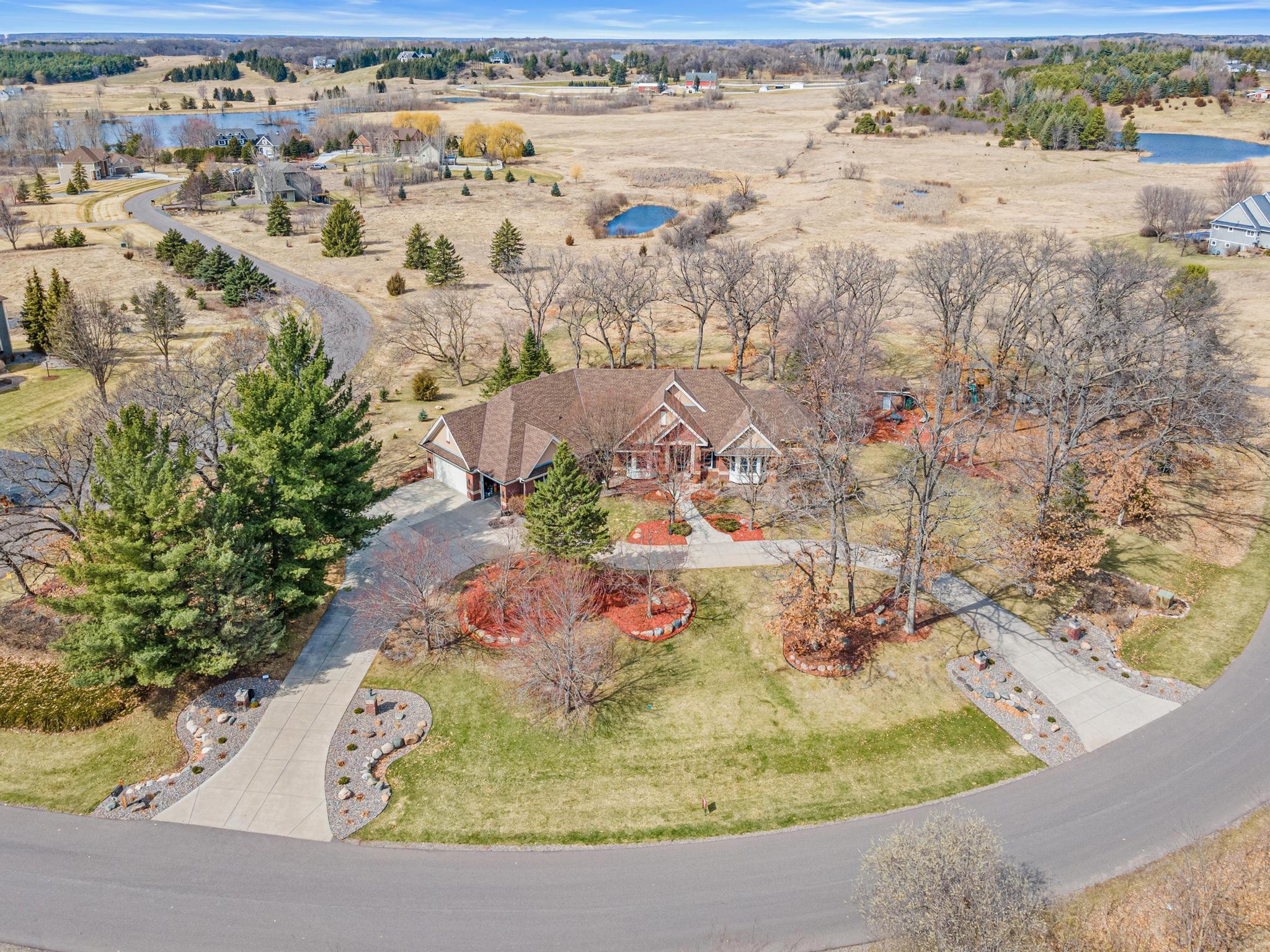 Expansive five-acre setting offers exceptional privacy, surrounded by mature trees and picturesque natural beauty.