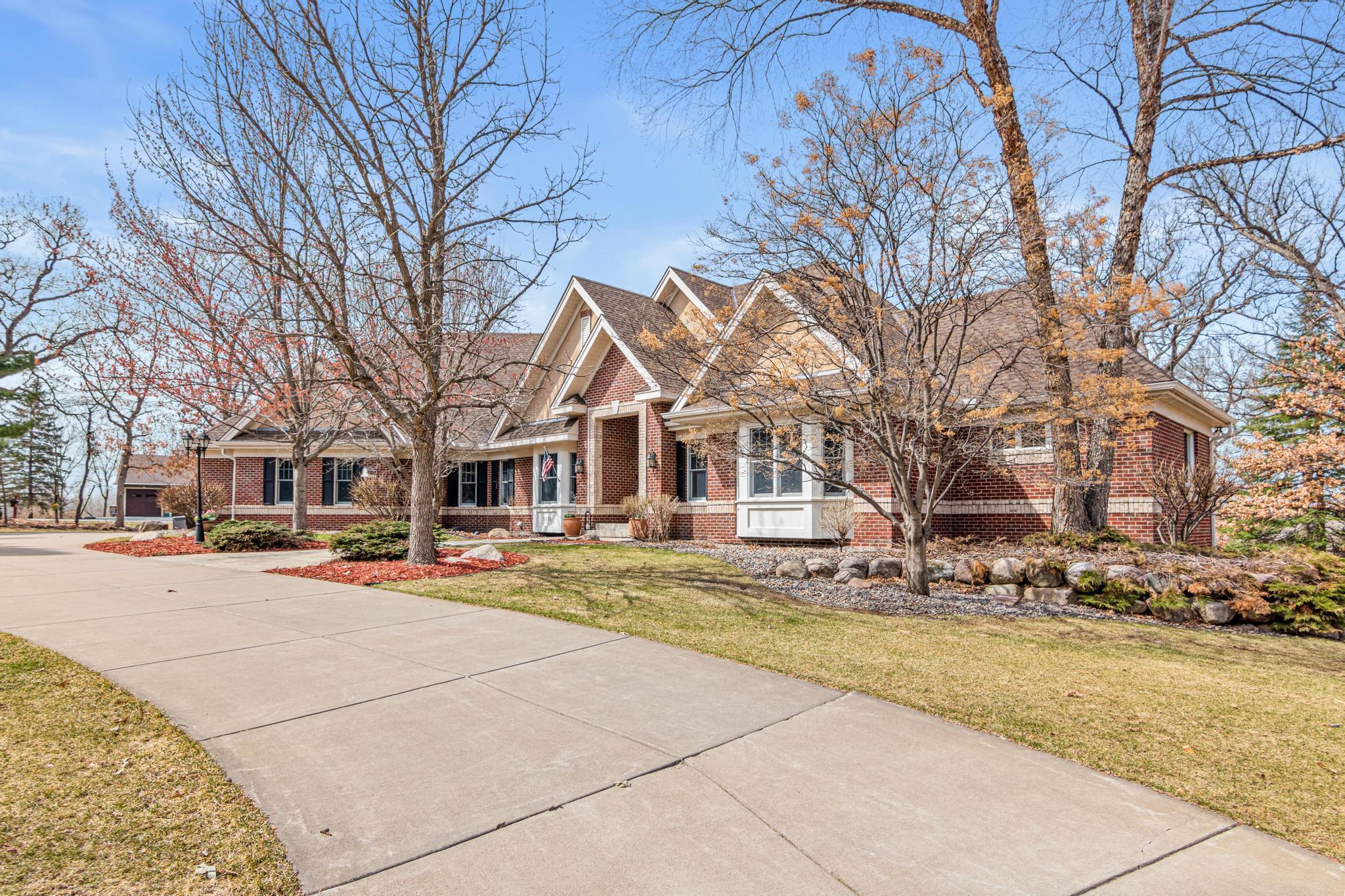 Exceptional custom DeWitt brick walkout rambler set on five private, professionally landscaped acres in the prestigious Grant/Dellwood area and award-winning Mahtomedi School District.