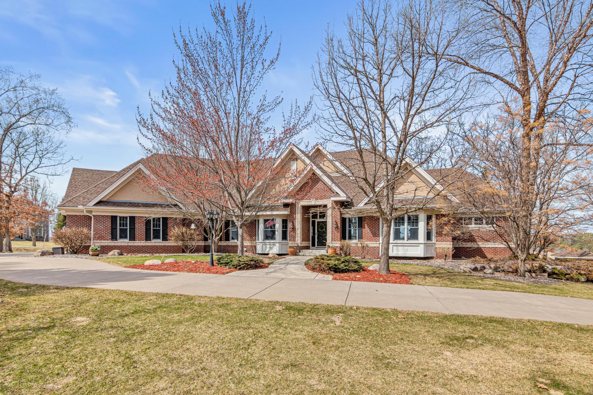 Stunning custom DeWitt brick walkout rambler set on five private, professionally landscaped acres in the coveted Grant/Dellwood area.