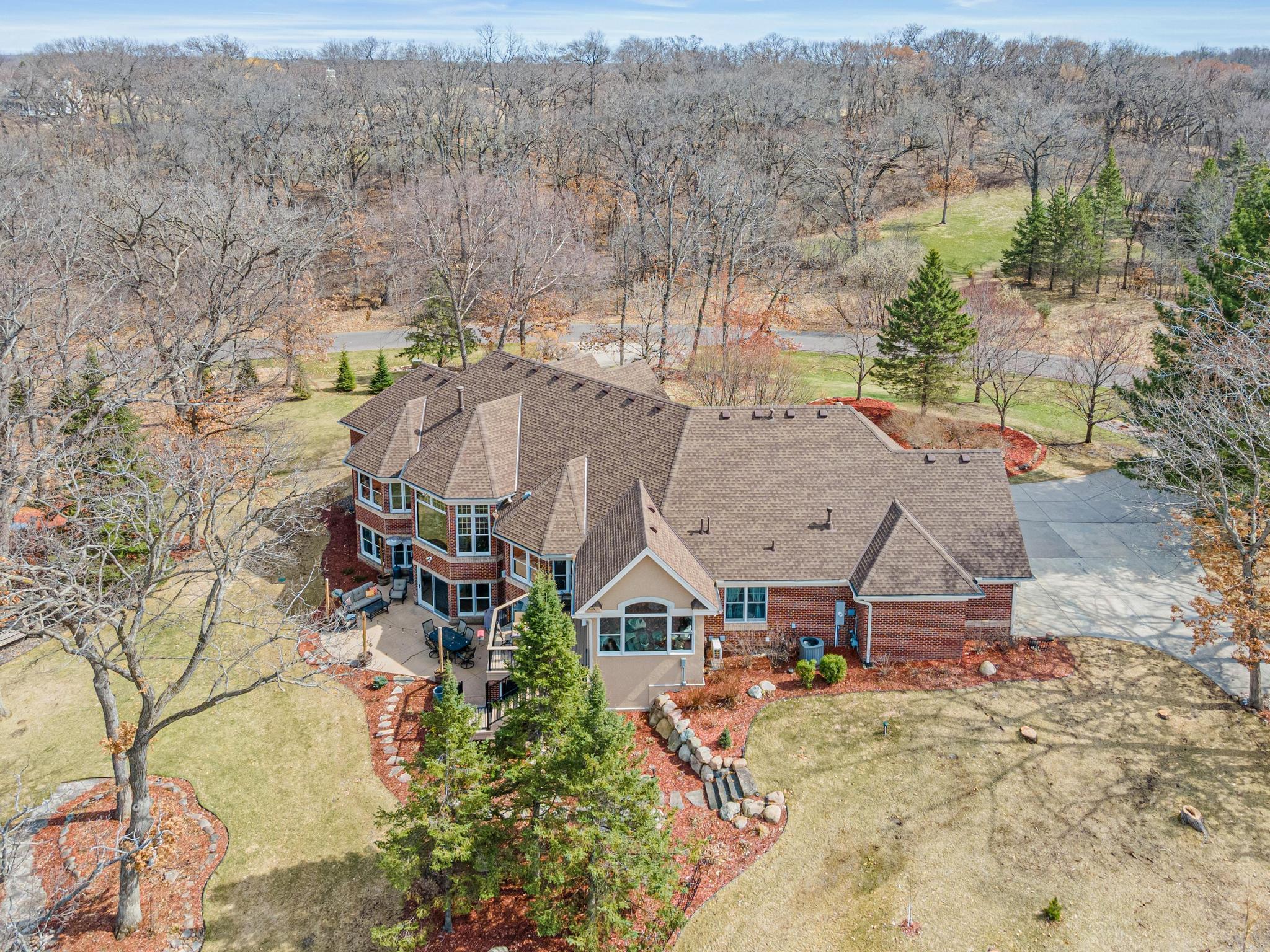Beautifully landscaped yard, expansive concrete patio and maintenance free deck extends the living space outdoors, perfect for gatherings and outdoor living.