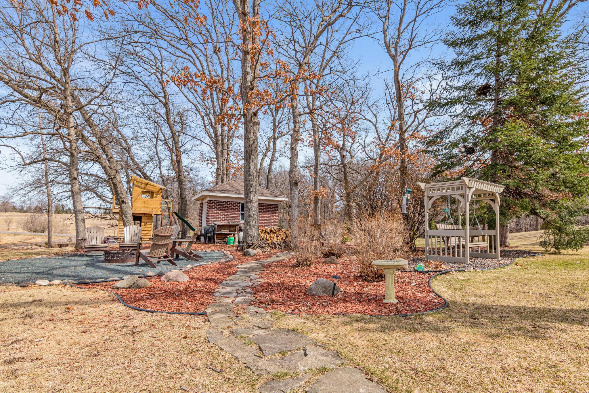Resort-like grounds provide a serene and secluded setting with multiple areas to relax and enjoy the outdoors. Fantastic tree house for kids, additional storage shed and bonfire pit.