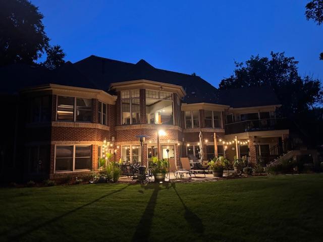 Spacious concrete patio at the walkout lower level offers seamless indoor-outdoor living and entertaining space.