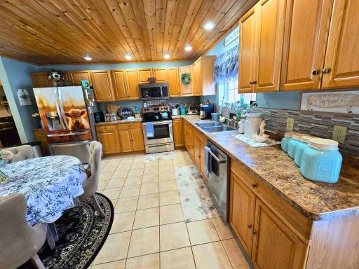 Stainless Steel Appliances and Natural Light Beaming Through the Kitchen.jpg