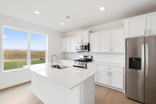 (Photo of a similar home, actual finishes may vary!)