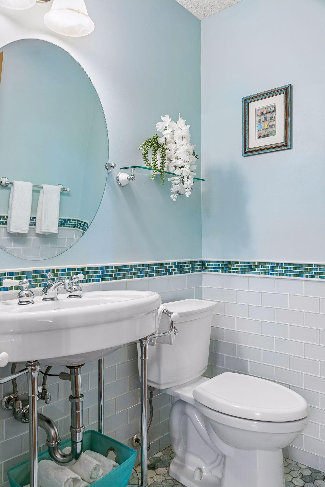 Main floor half bath with a pop of color