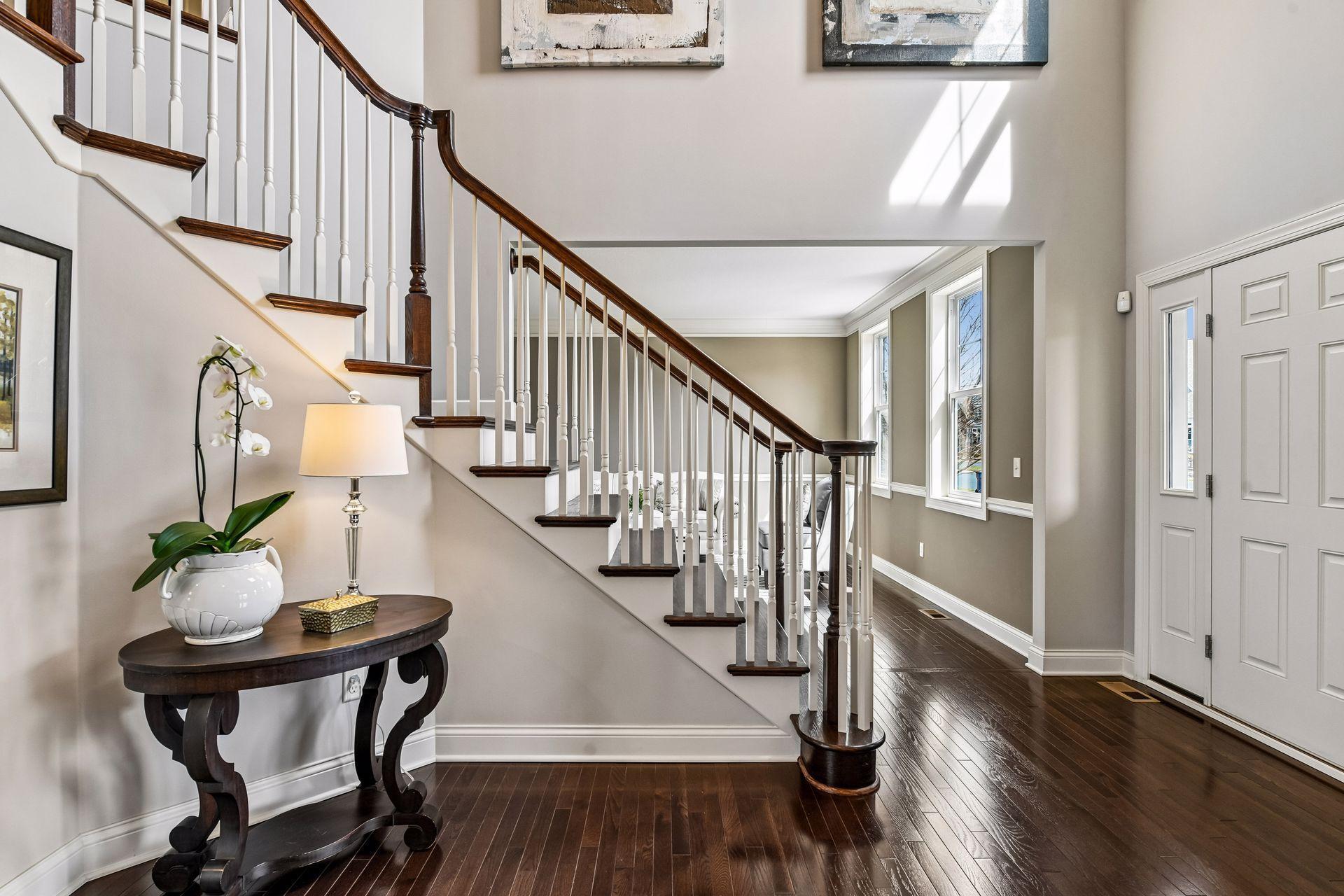 A soaring vaulted foyer and stunning turned staircase create an elegant first impression.