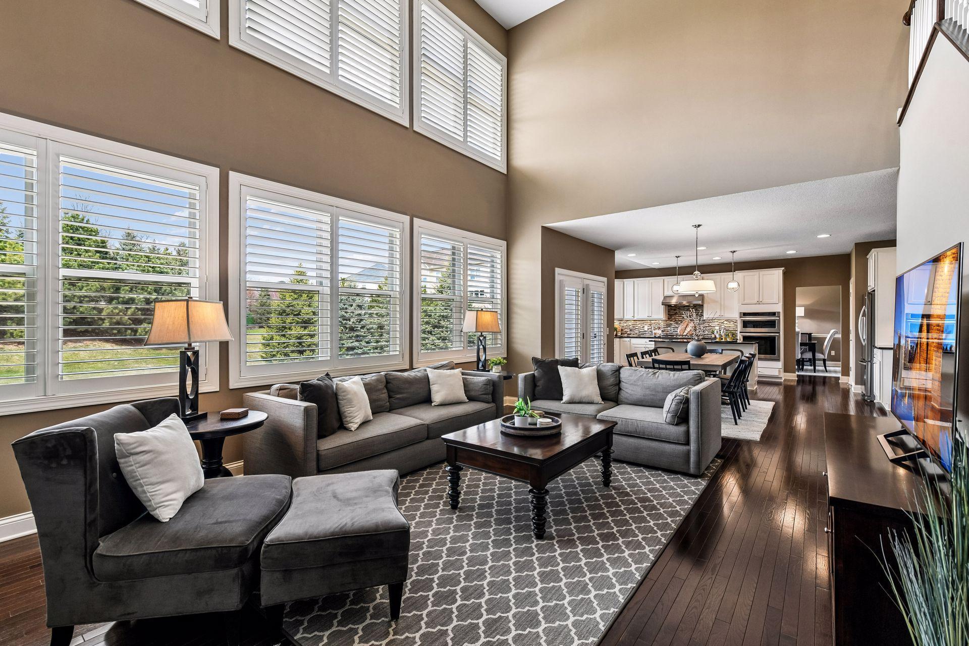 Spacious vaulted great room with expansive windows and an open, airy feel.