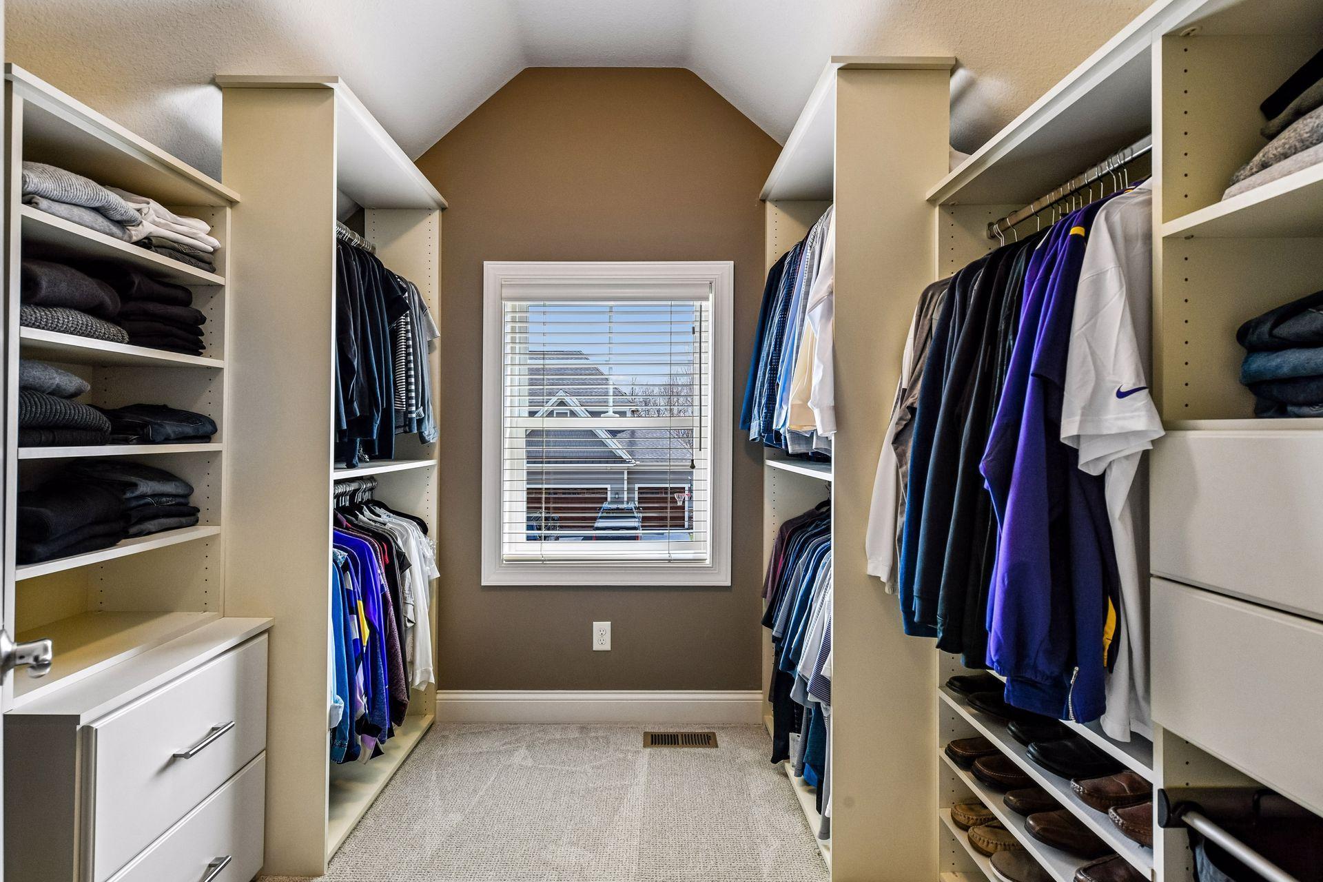 Primary bedroom walk-in closet.