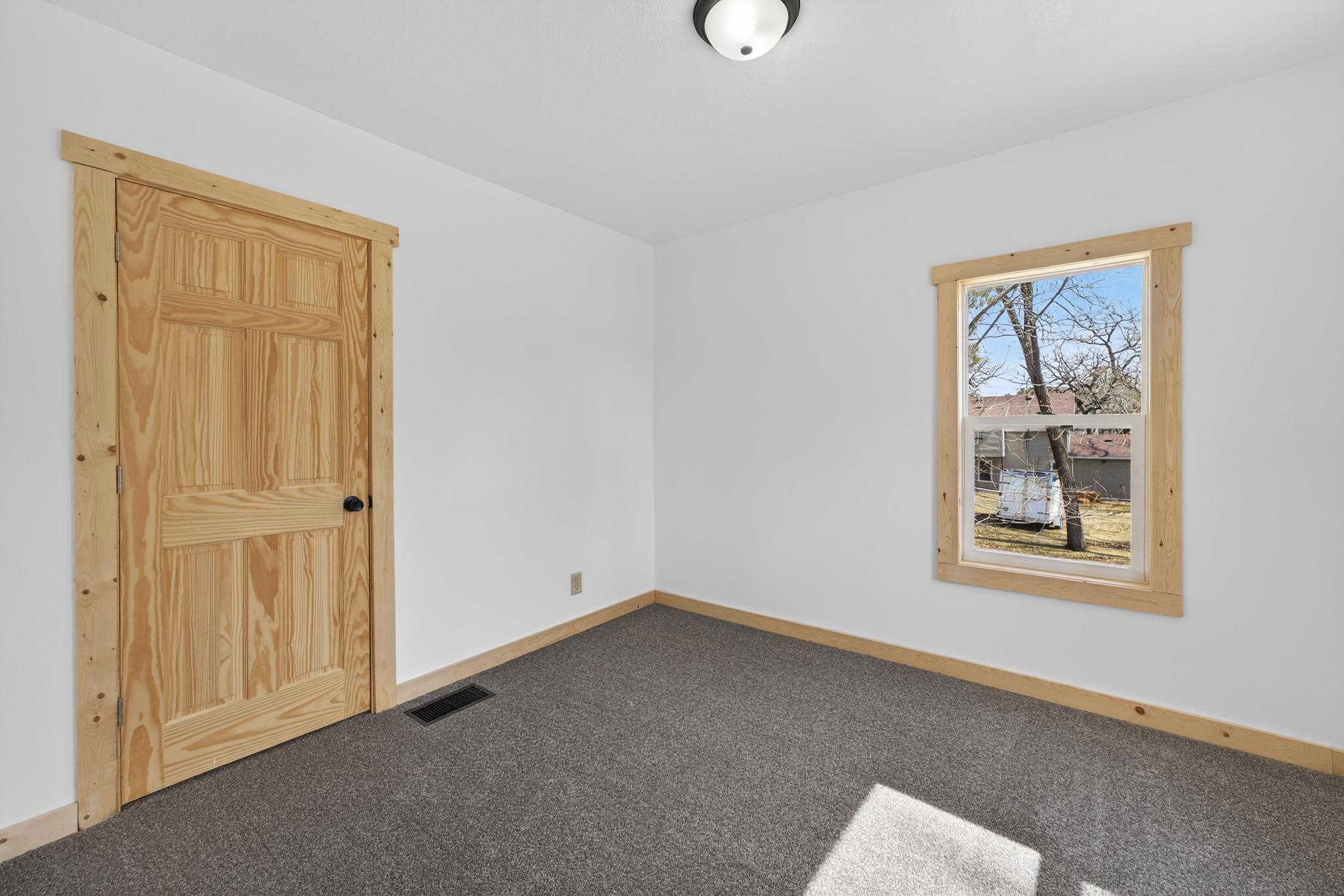 Bedroom is located off of the kitchen.